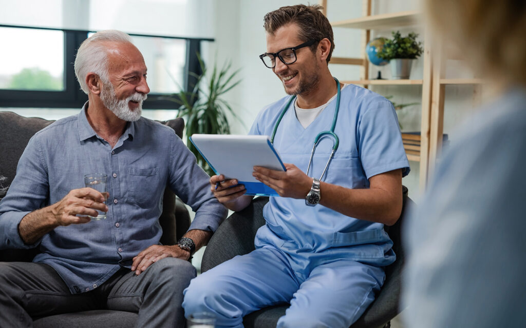 Doctor consulting elderly patient